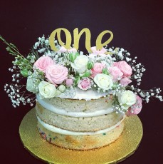 1st birthday naked cake with fresh flowers